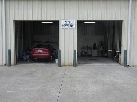 Red car in Detailing shop | Car Detailing in Cartersville, GA by Candy Apple Custom Collision II